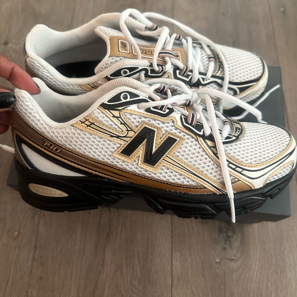 New Balance White and Gold Athletic Shoes